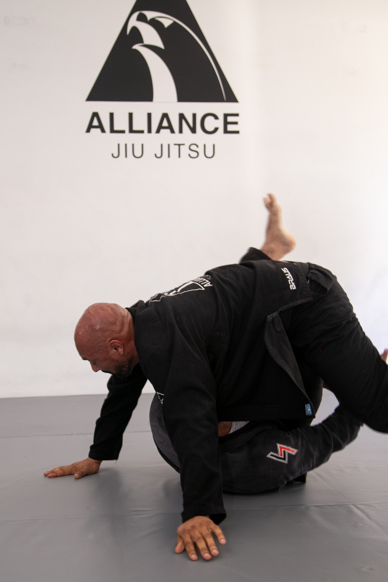 Professor Alliance Jiu Jitsu em treino no tatame